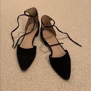 Suede black flats with ties at the ankle